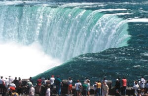 Group of people looking over Niagara Falls